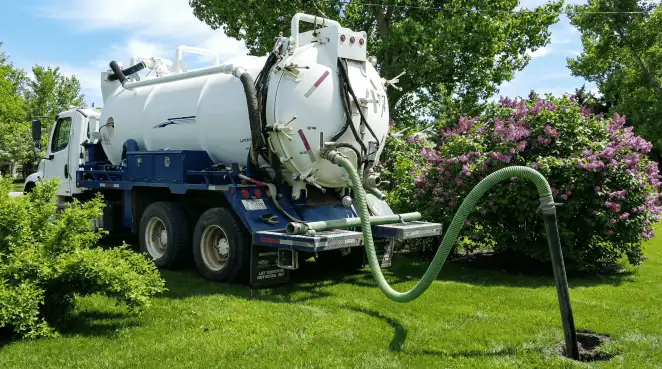 Professional vacuum truck performing residential drainage and septic maintenance in Minneapolis, MN